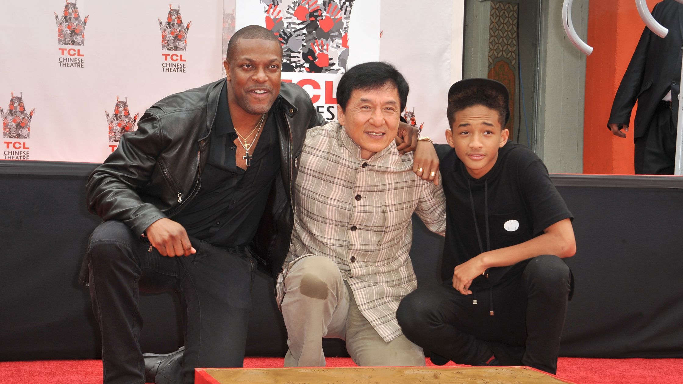 LOS ANGELES, CA - JUNE 6, 2013: Jackie Chan with Chris Tucker (left) & Jaden Smith at Chan's hand & footprint ceremony in the courtyard of the TCL Chinese Theatre, Hollywood. (Jaguar PS/Shutterstock.com)