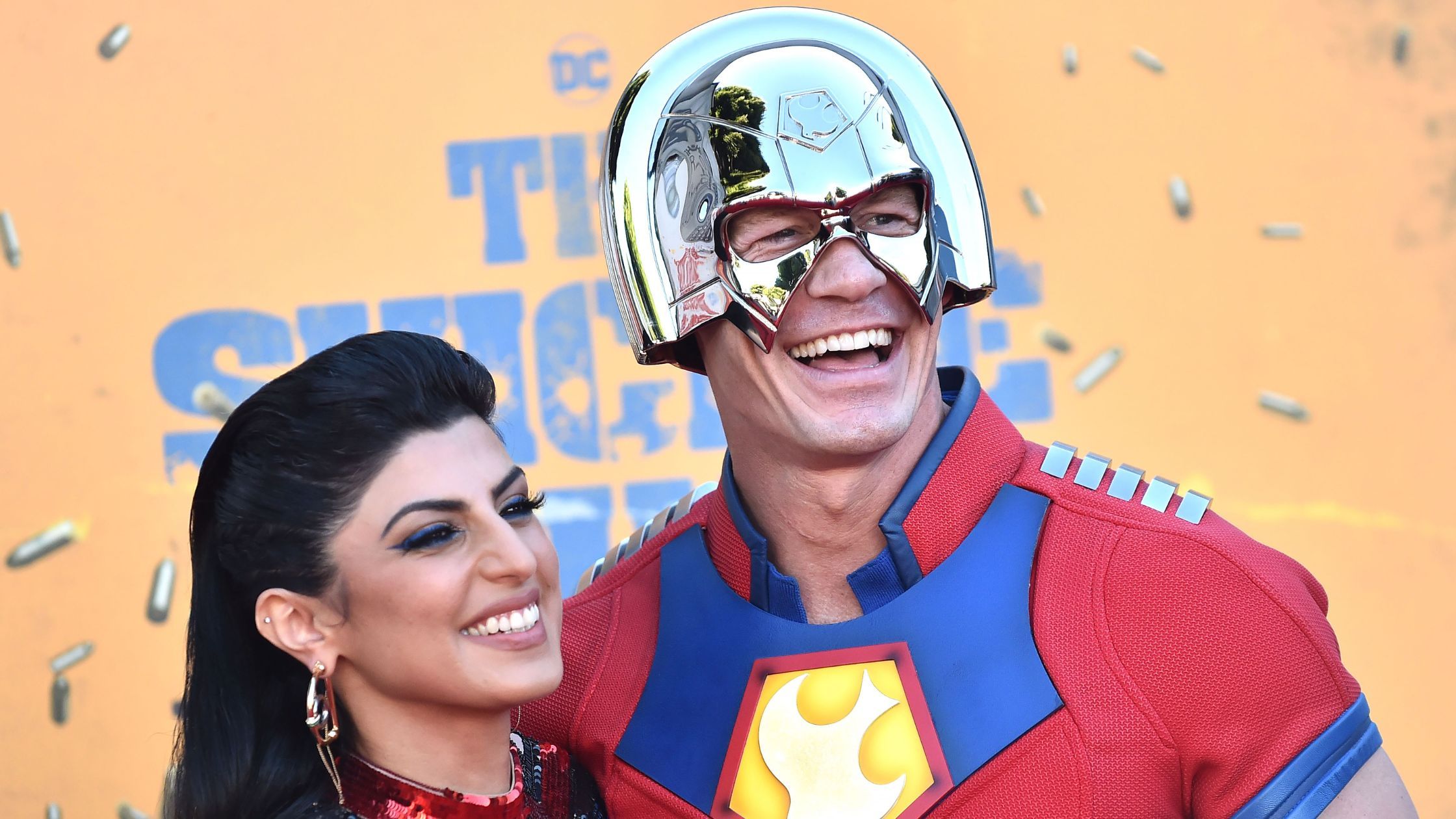 LOS ANGELES - AUG 03: John Cena and Shay Shariatzadeh arrives for the ÔSuicide SquadÕ Hollywood Premiere on August 02, 2021 in Westwood, CA ( DFree / Shutterstock)